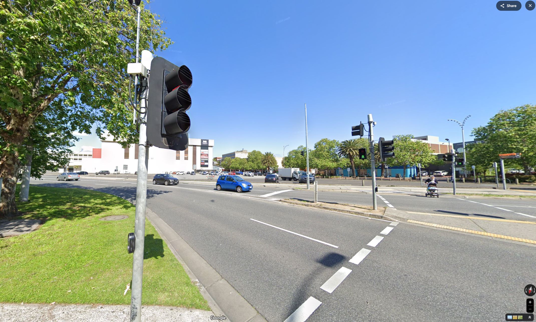 Current: Current view from Clow Street and Lonsdale Street intersection showing improved tree lined streetscape, prioritised pedestrian paths and activated building interface. 